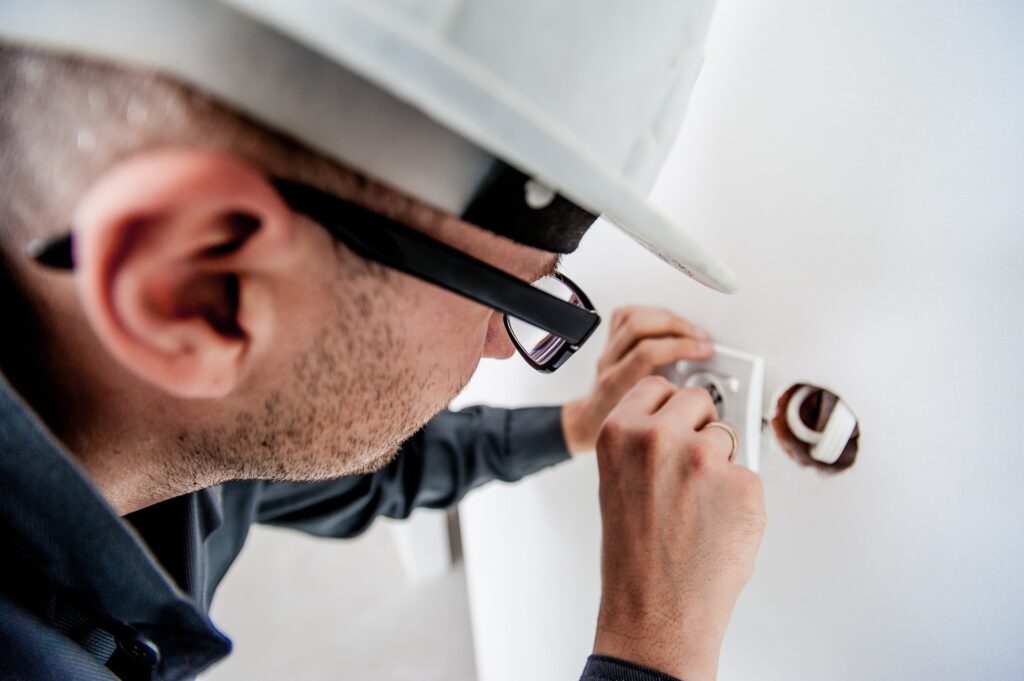A electrician working on the socket.