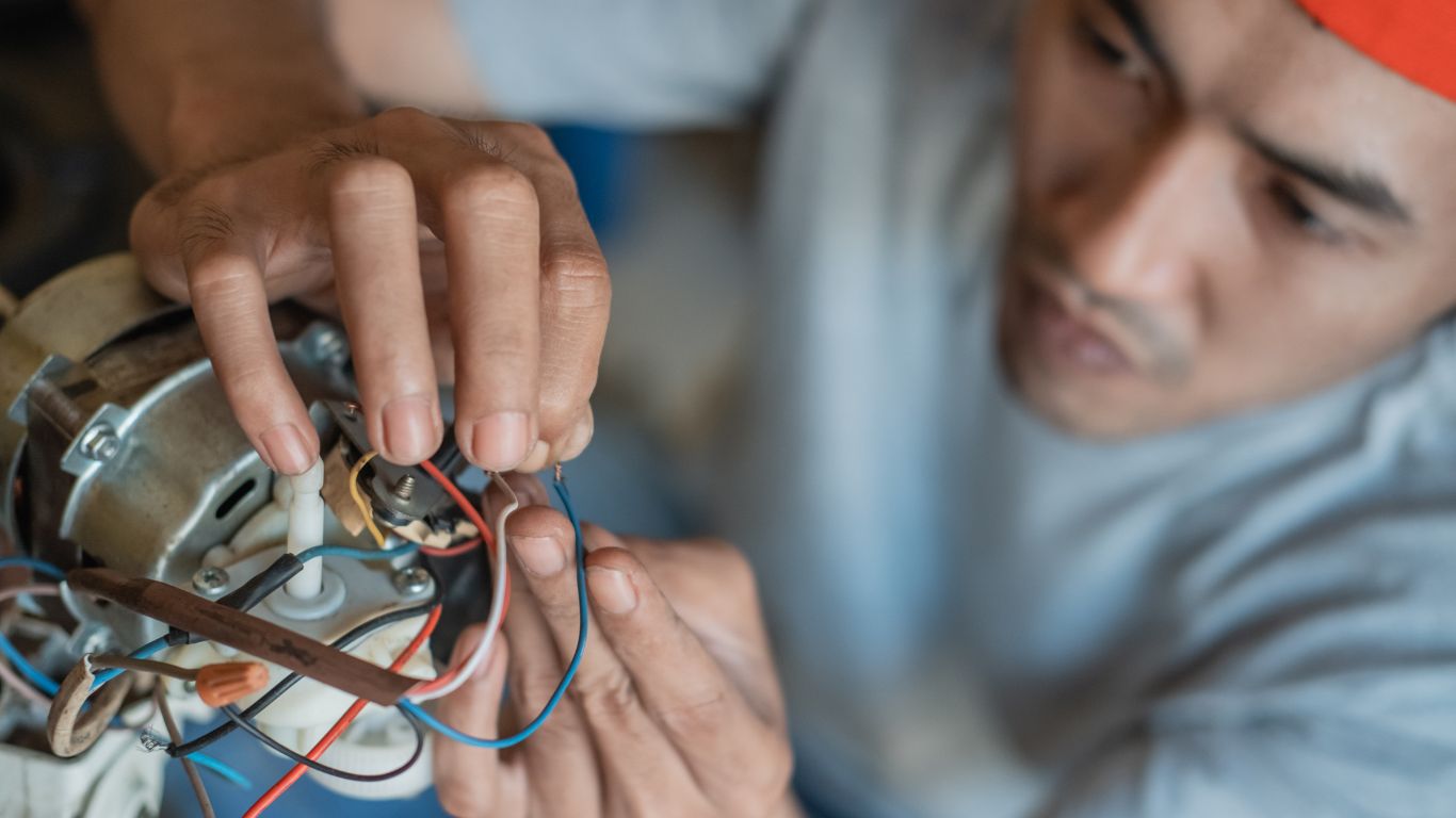 An electrician fixing the motor.