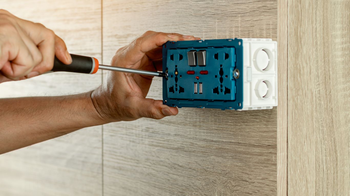 An electrician installing a socket.